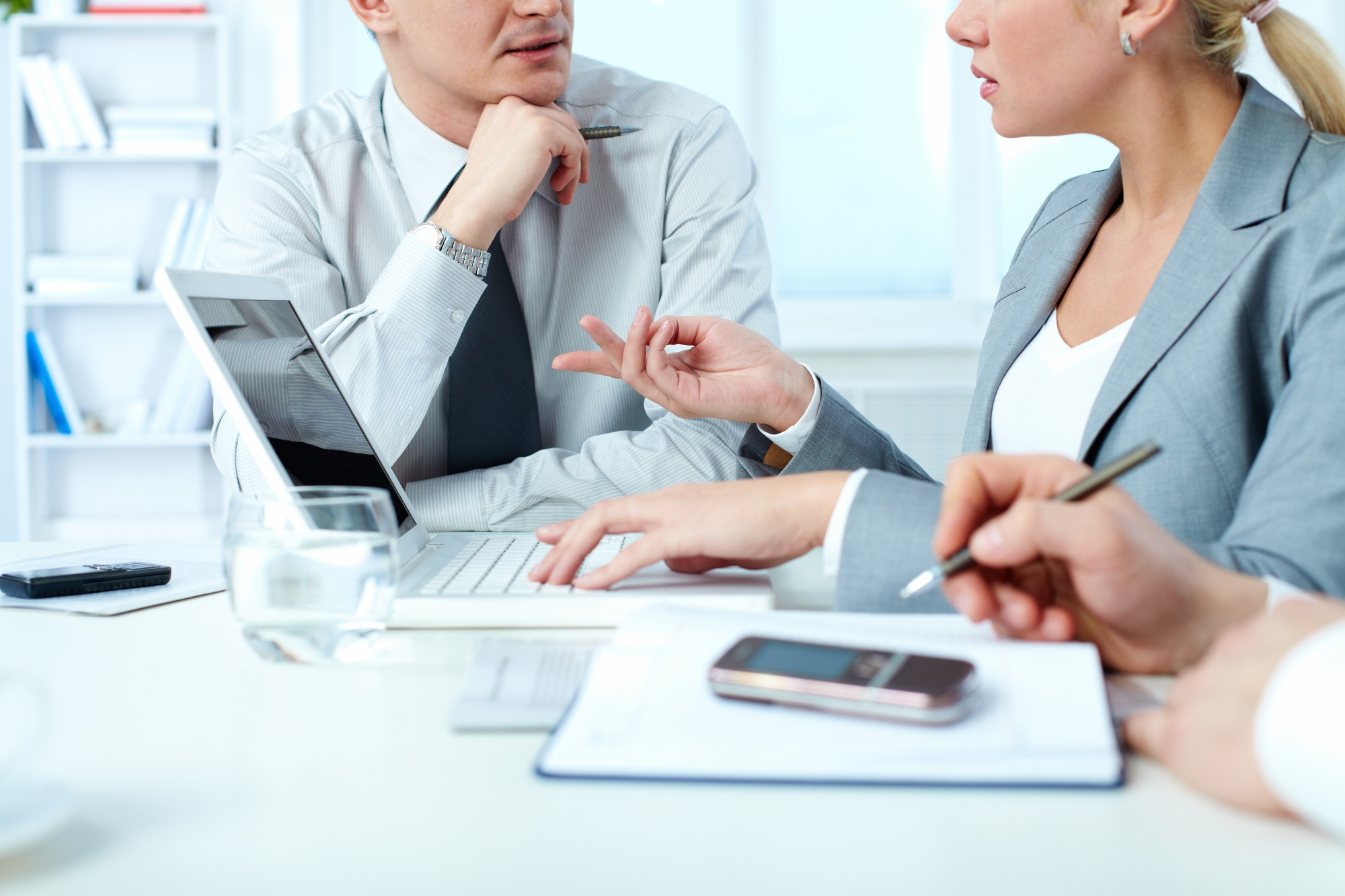 Professional business environment, modern office setting with clean lines and minimalistic design, focused on accounting services in Kazakhstan, digital tools and financial documents on a sleek desk, professional team collaborating in the background, neutral color palette, high-quality lighting, emphasizing trust and efficiency in financial services